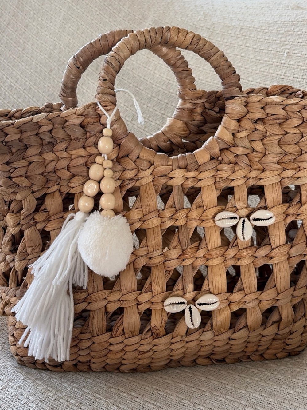 Woven Straw Tote Bag with White Tassel Charm